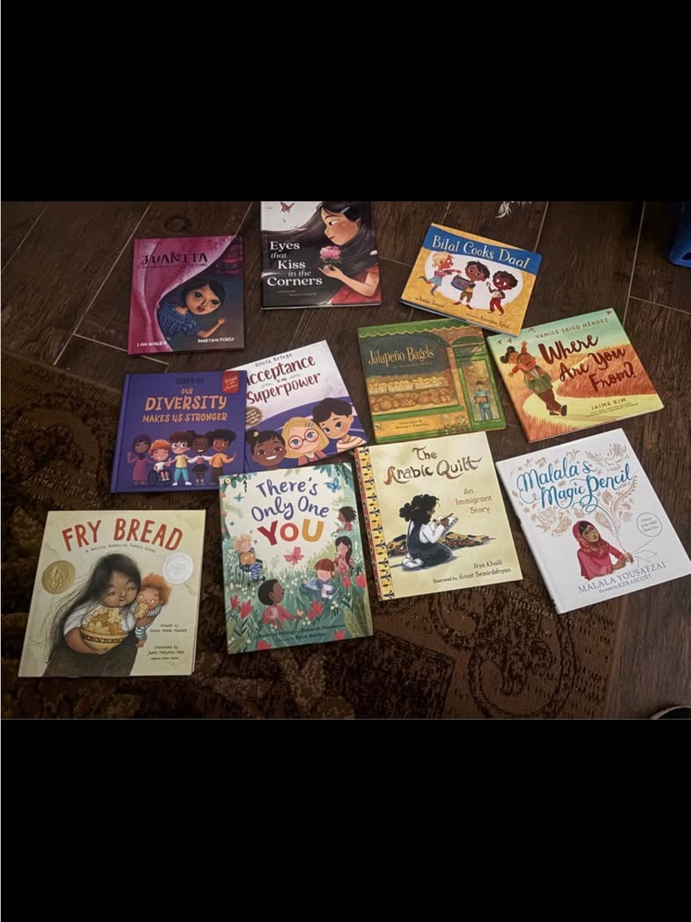 11 Hardcovered books on diversity.  Beautiful stories